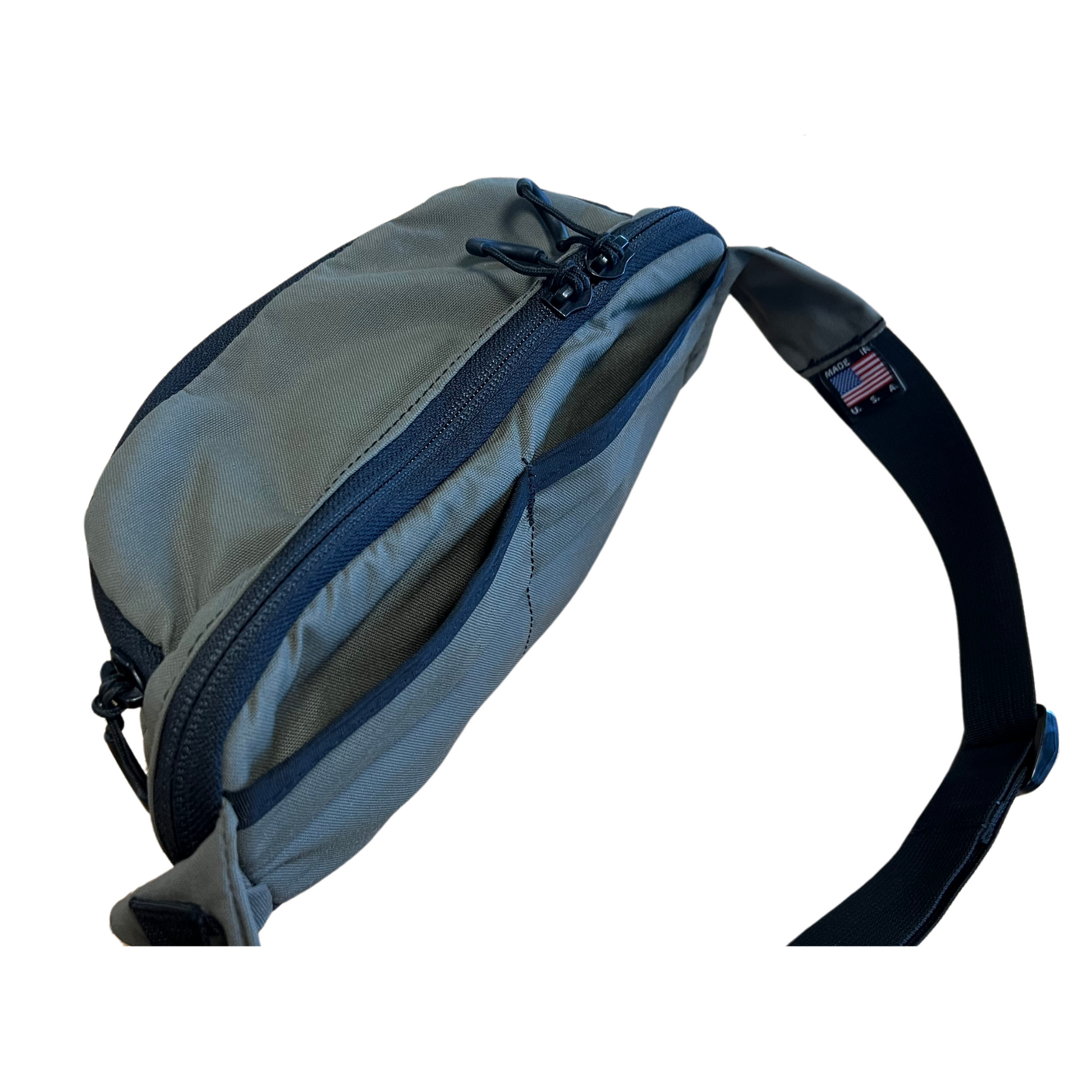 Nut Ruck Waist pack in Ranger Green with the dual rear slip pockets open for additional storage.