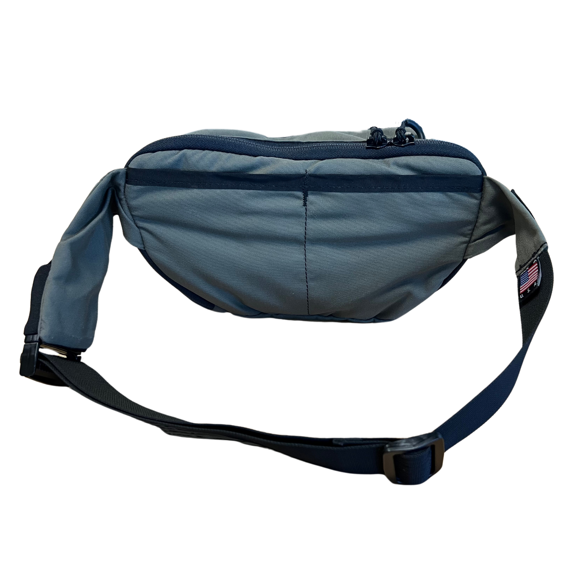 Nut Ruck waist pack in Ranger Green showing the rear dual slip pockets for additional storage.