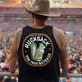 Nut Ruck Original Tank top in Black worn by a man with an athletic build and tattoos wearing a brown cowboy hat looking out over a stadium of people